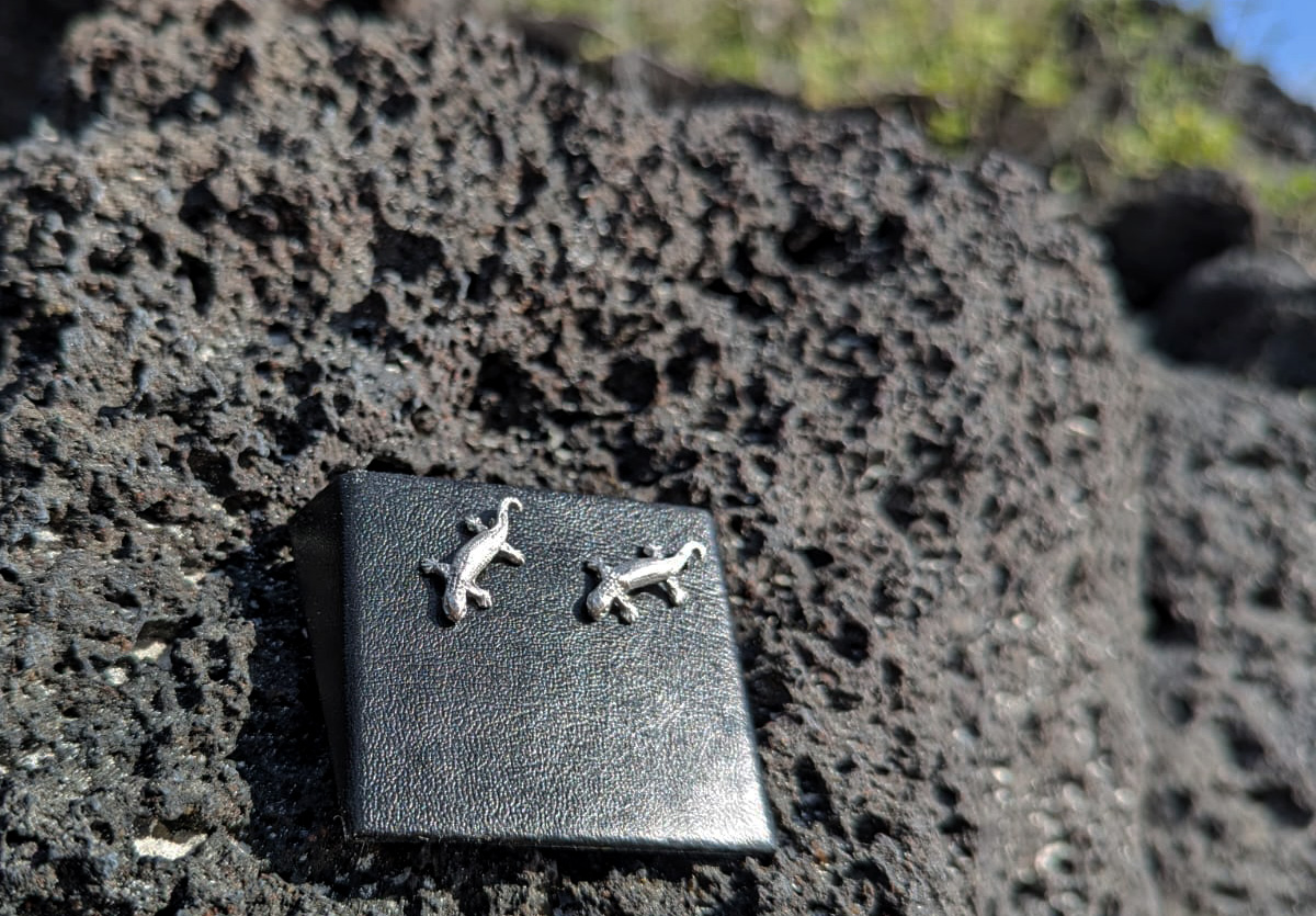 Iguana silver earrings on lava rock