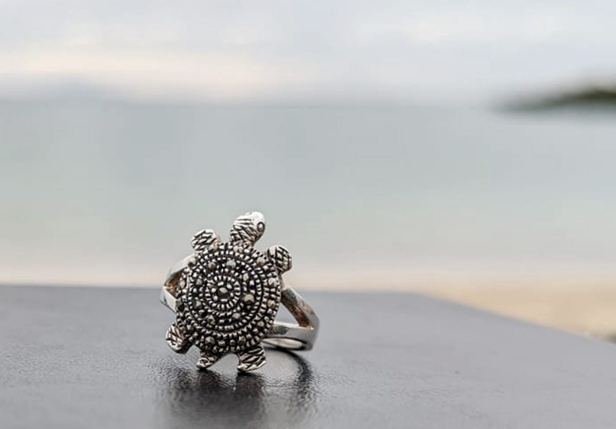 Sea turtle ring on black base with cubic zirconias